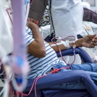 Unidentified patient sitting in chair while undergoing kidney dialysis. Image, Adobe 